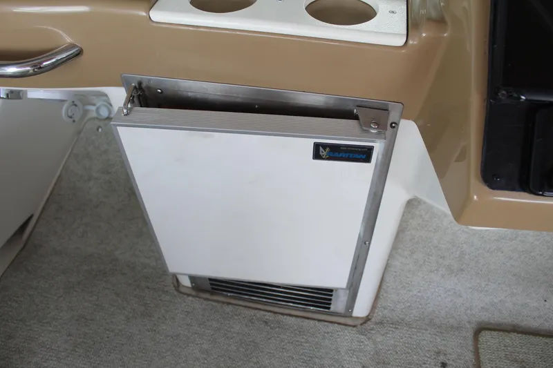 Slide: The Image of 2004 Carver 360 Mariner interior with built-in refrigerator and cup holders. - 31