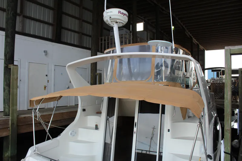 Slide: The Image of 2004 Carver 360 Mariner yacht docked in a covered marina. - 7