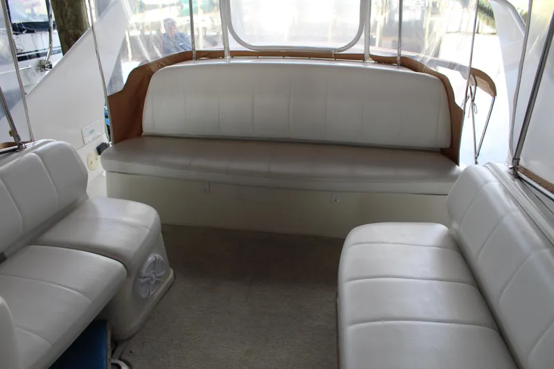 Slide: The Image of 2004 Carver 360 Mariner interior with white seating and spacious layout. - 32