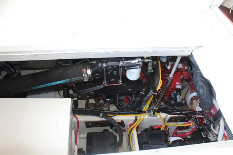 Slide: The Image of Engine compartment of a 2004 Carver 360 Mariner with visible wiring and components. - 36
