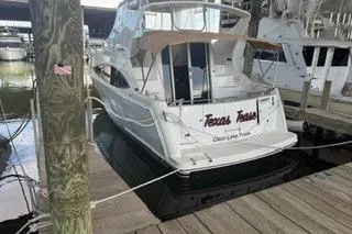 Slide: The Image of 2004 Carver 360 Mariner docked at marina, rear view. - 10