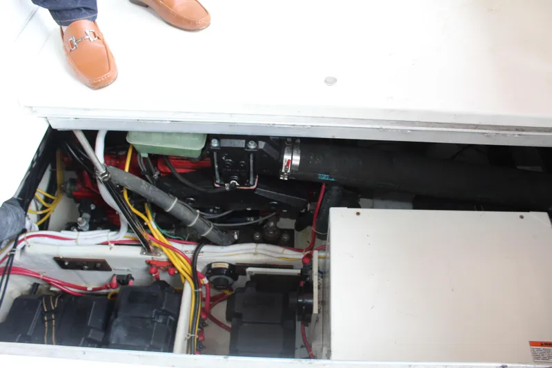 Slide: The Image of Engine compartment of a 2004 Carver 360 Mariner with visible wiring and components. - 37