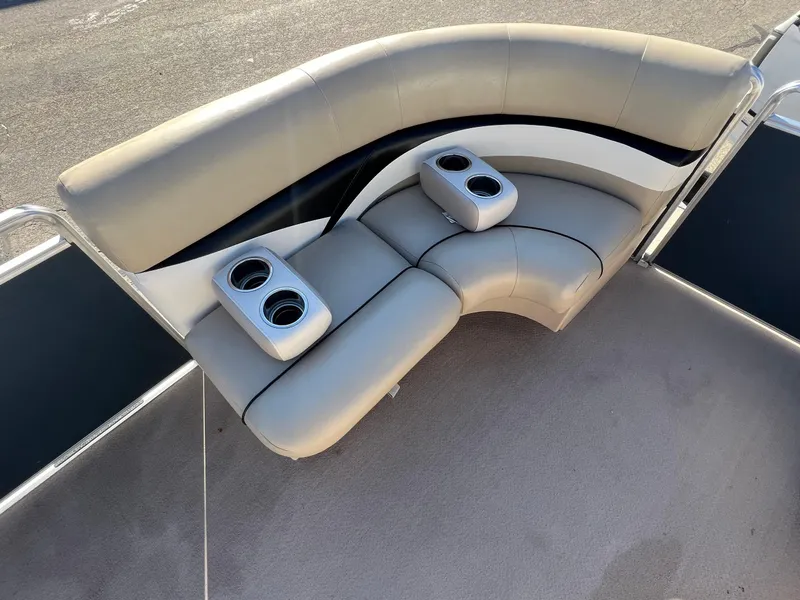 Slide: The Image of 2013 Harris FloteBote Cruiser boat seating with cup holders, gray upholstery. - 12