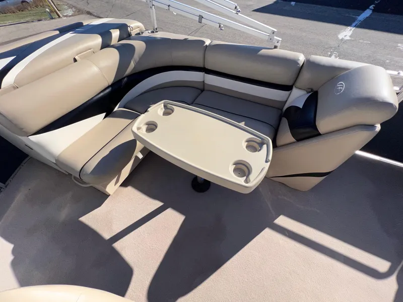 Slide: The Image of 2013 Harris FloteBote Cruiser interior with beige seating and table. - 14