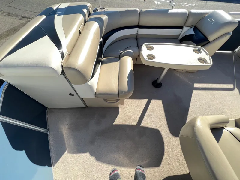 Slide: The Image of 2013 Harris FloteBote Cruiser interior with beige seating and table. - 15