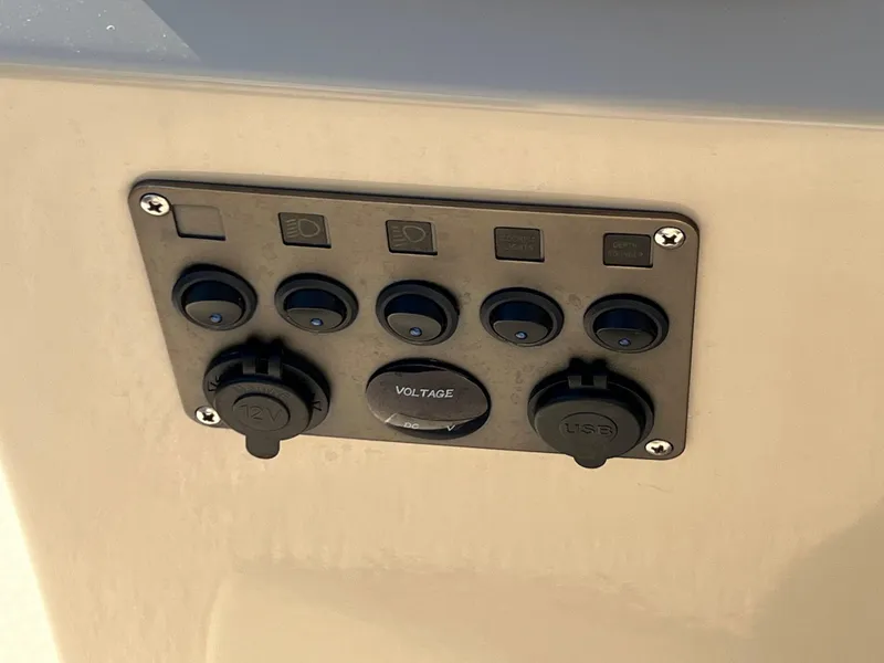 Slide: The Image of Control panel on a 2013 Harris FloteBote Cruiser with voltage and USB ports. - 23