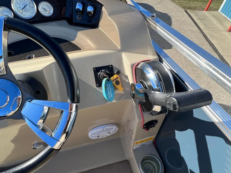Slide: The Image of 2013 Harris FloteBote Cruiser steering console with controls and gauges. - 24