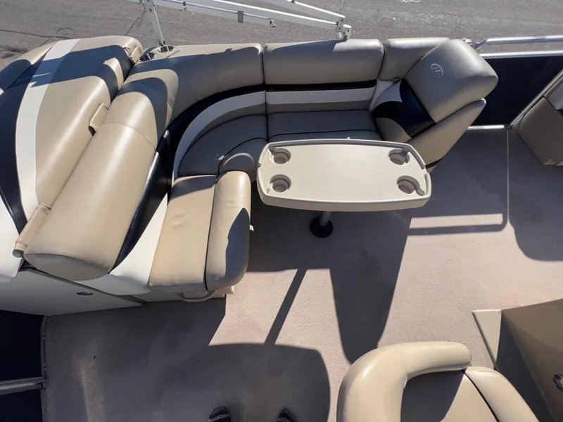 Slide: The Image of 2013 Harris FloteBote Cruiser interior with beige seating and table. - 26