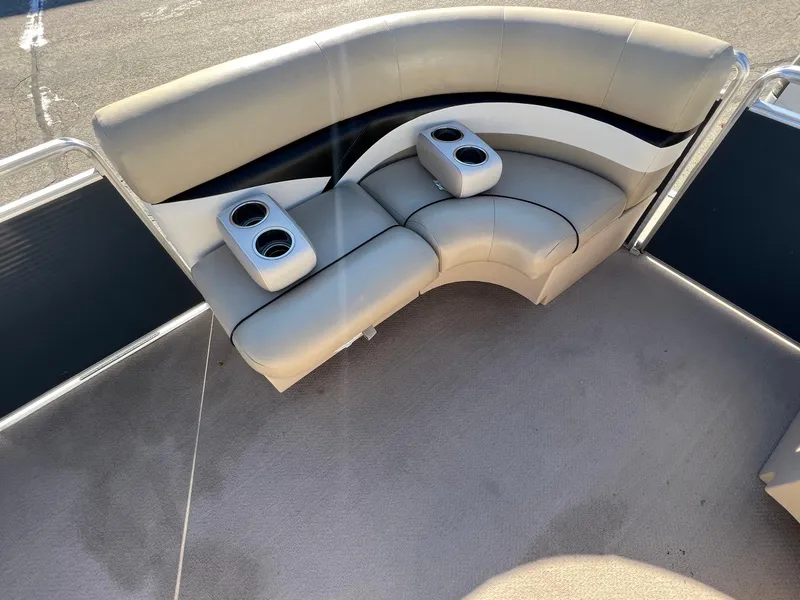 Slide: The Image of 2013 Harris FloteBote Cruiser boat seating with cup holders, beige upholstery. - 28