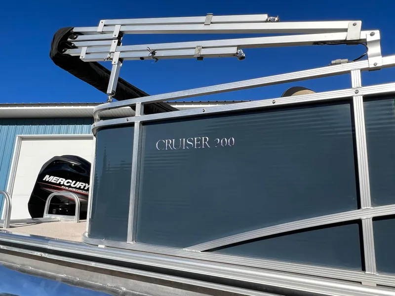 Slide: The Image of 2013 Harris FloteBote Cruiser 200 pontoon boat with Mercury engine in a sunny setting. - 3