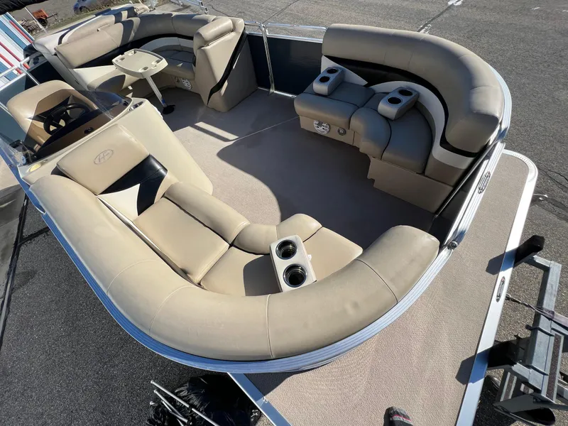 Slide: The Image of 2013 Harris FloteBote Cruiser pontoon boat interior with beige seating and cup holders. - 30