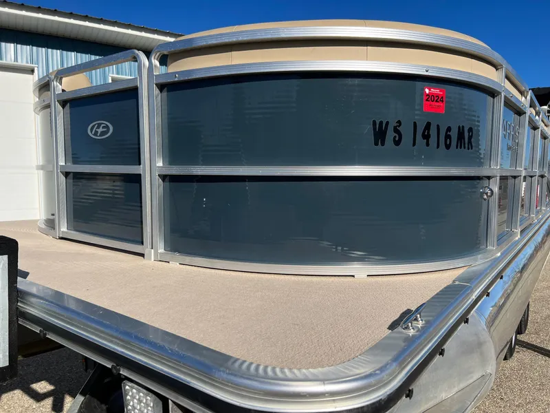 Slide: The Image of 2013 Harris FloteBote Cruiser pontoon boat, gray exterior, docked outdoors. - 8