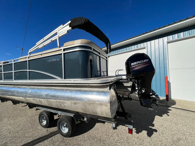 Slide: The Image of 2013 Harris FloteBote Cruiser pontoon boat with Mercury outboard motor on trailer. - 9