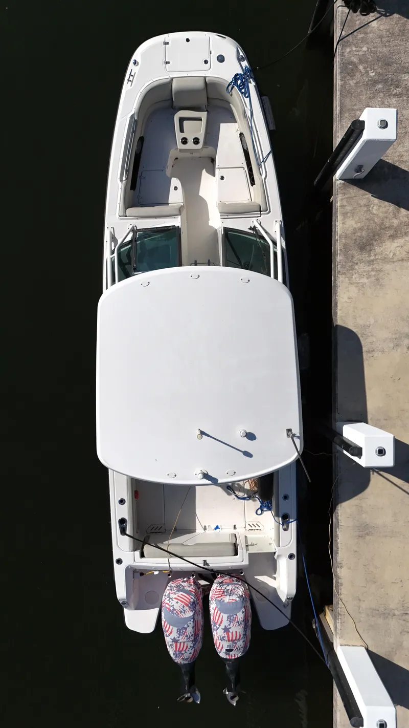 Slide: The Image of Overhead view of a 2014 Boston Whaler 270 Vantage docked at a marina. - 6