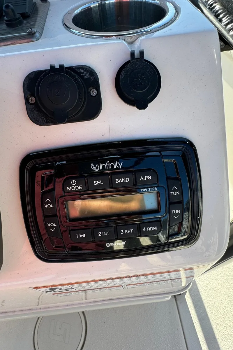 Slide: The Image of Infinity stereo system on 2021 Sea Chaser 26LX boat dashboard. - 20