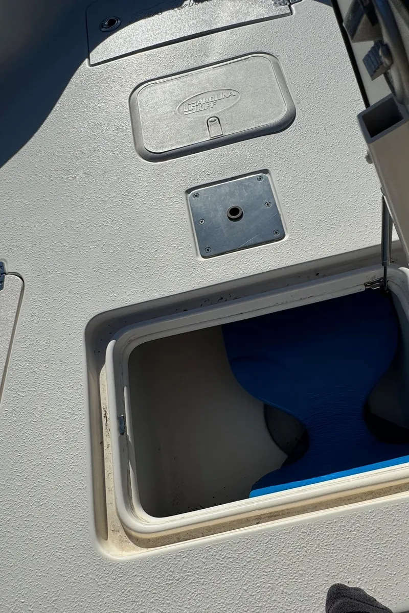 Slide: The Image of 2021 Sea Chaser 26LX boat storage compartment with open hatch. - 32