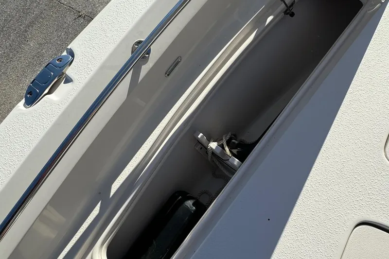 Slide: The Image of 2021 Sea Chaser 26LX boat storage compartment with stainless steel hardware. - 33