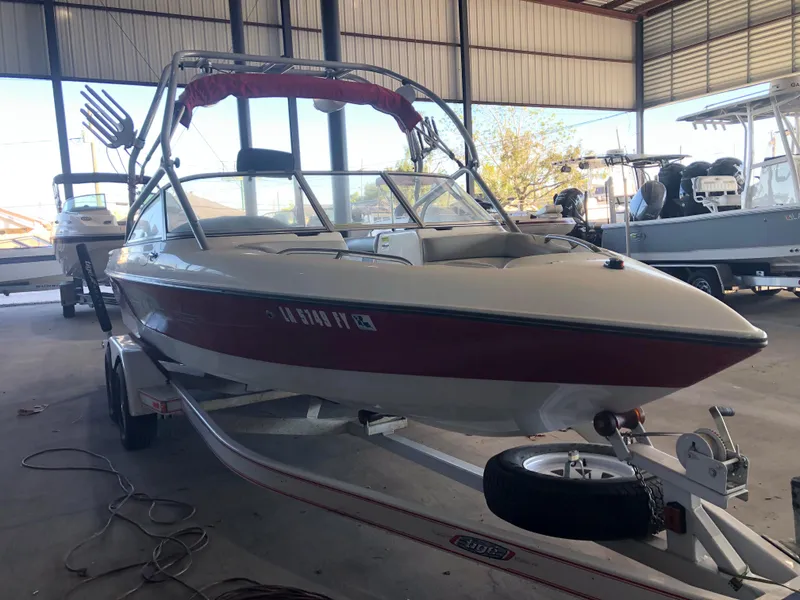 Slide: The Image of 2004 Tigé 22I TYPE R boat on trailer in storage facility. - 5