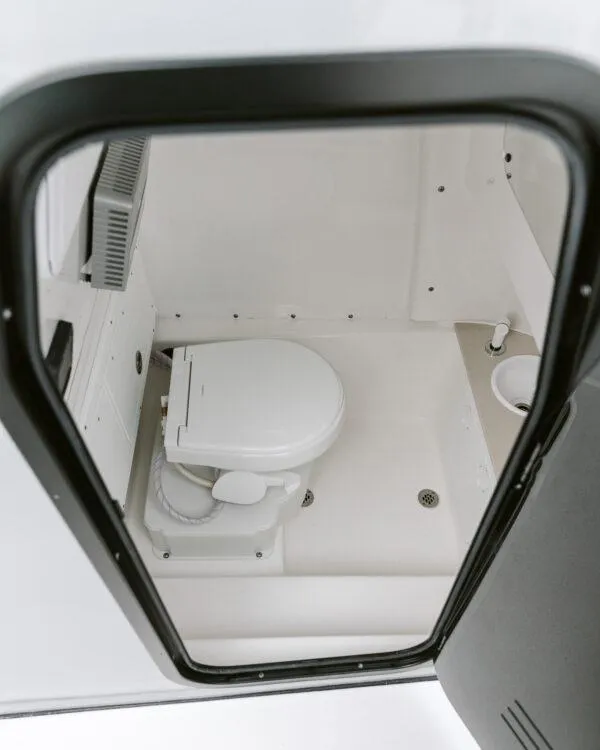 Slide: The Image of 2025 Sea Pro 245 FLX boat interior bathroom with toilet. - 5