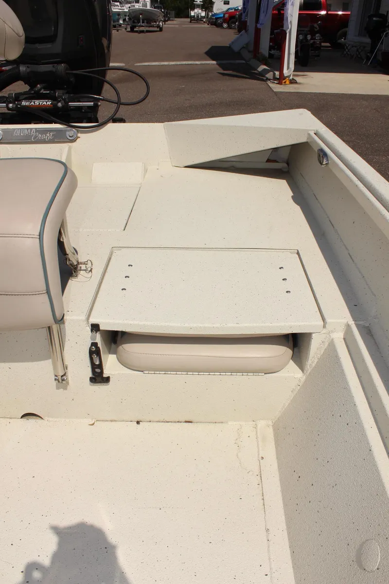 Slide: The Image of 2020 Alumacraft 20 Coastal Bay boat interior with seating and storage. - 16