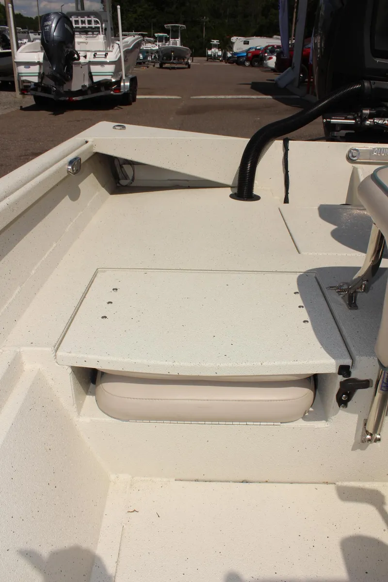 Slide: The Image of 2020 Alumacraft 20 Coastal Bay boat interior with seating and storage. - 18