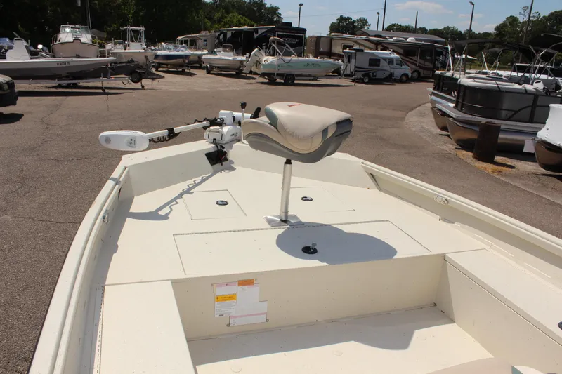 Slide: The Image of 2020 Alumacraft 20 Coastal Bay boat with seating, parked in a marina. - 27