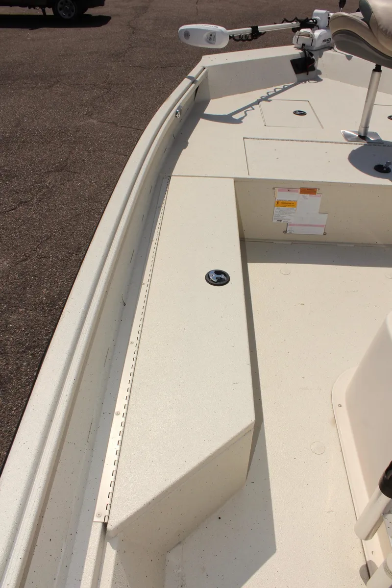 Slide: The Image of 2020 Alumacraft 20 Coastal Bay boat deck with seating and controls. - 28