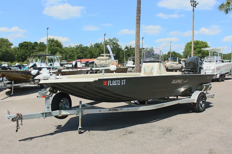Slide: The Image of 2020 Alumacraft 20 Coastal Bay boat on trailer in sunny marina. - 3