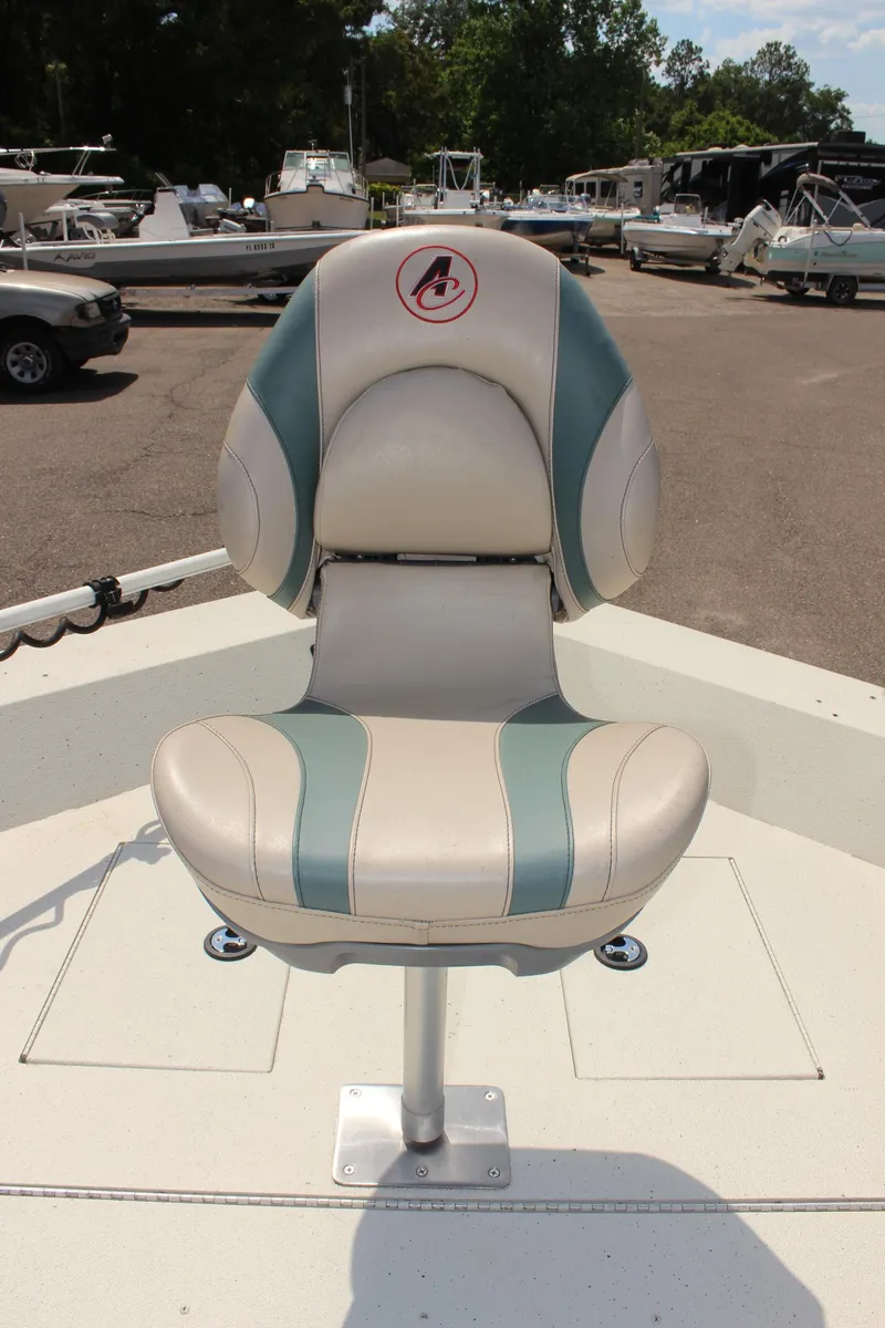 Slide: The Image of 2020 Alumacraft 20 Coastal Bay boat seat in marina setting. - 34