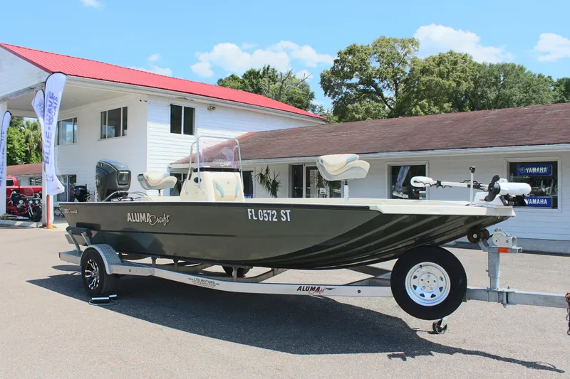 Slide: The Image of 2020 Alumacraft 20 Coastal Bay boat on trailer outside dealership. - 6