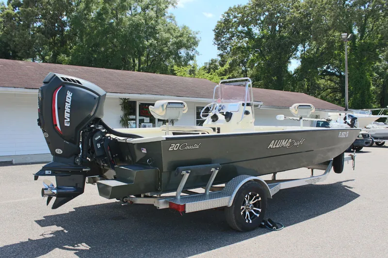 Slide: The Image of 2020 Alumacraft 20 Coastal Bay boat on trailer, parked outdoors. - 9