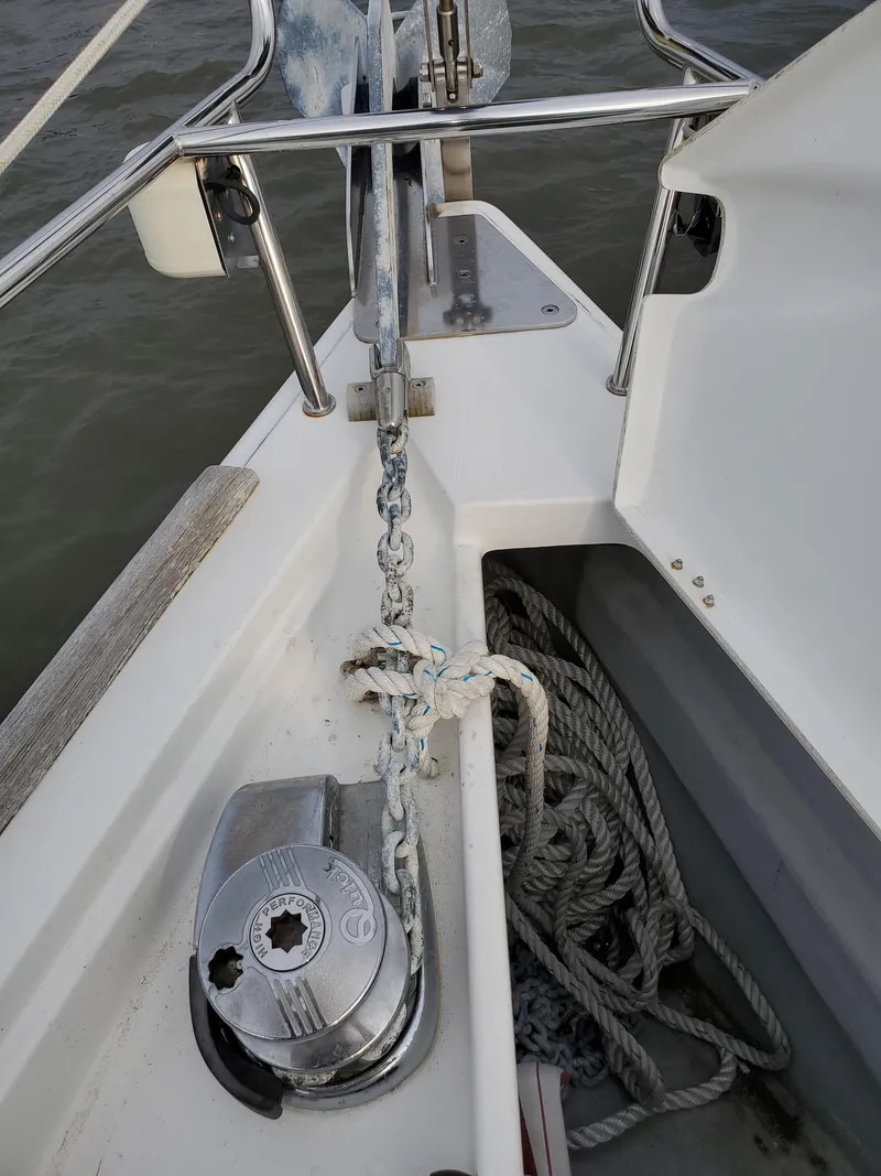 Slide: The Image of Anchor chain and windlass on 2008 Beneteau 43 sailboat deck. - 17