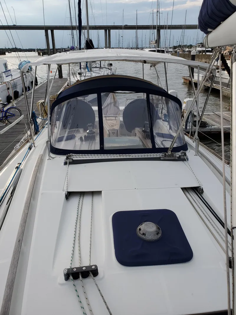 Slide: The Image of 2008 Beneteau 43 sailboat docked at marina, featuring sleek design and spacious deck. - 18