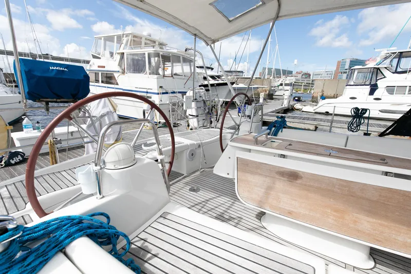 Slide: The Image of Beneteau 43 sailboat cockpit, 2008 model, docked at marina with clear skies. - 20