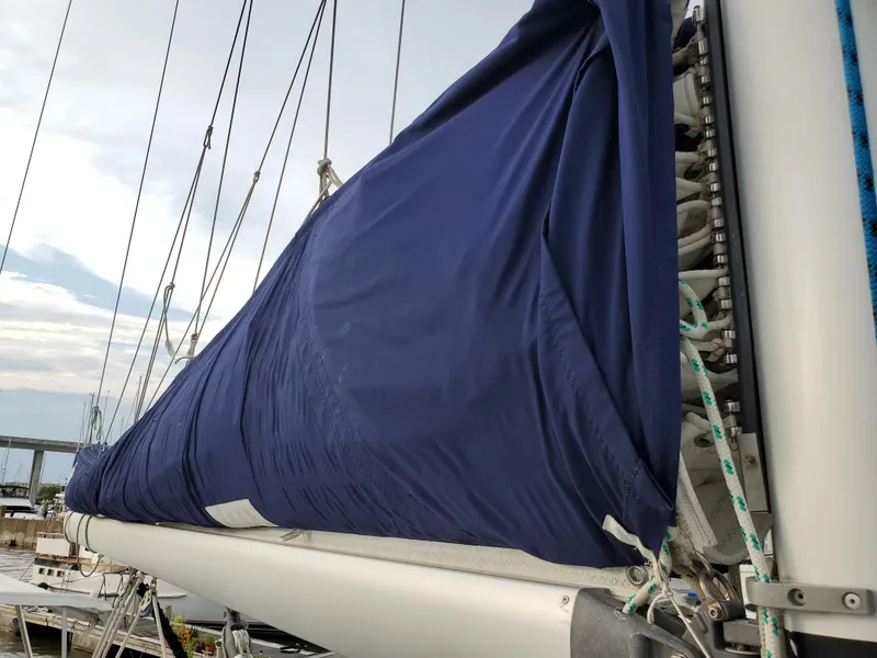 Slide: The Image of Beneteau 43 sailboat mast with blue sail cover, 2008 model. - 22