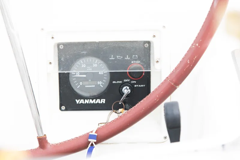 Slide: The Image of Yanmar engine control panel on 2008 Beneteau 43 sailboat with red steering wheel. - 26