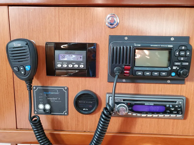 Slide: The Image of Beneteau 43 (2008) control panel with radio and navigation equipment. - 47