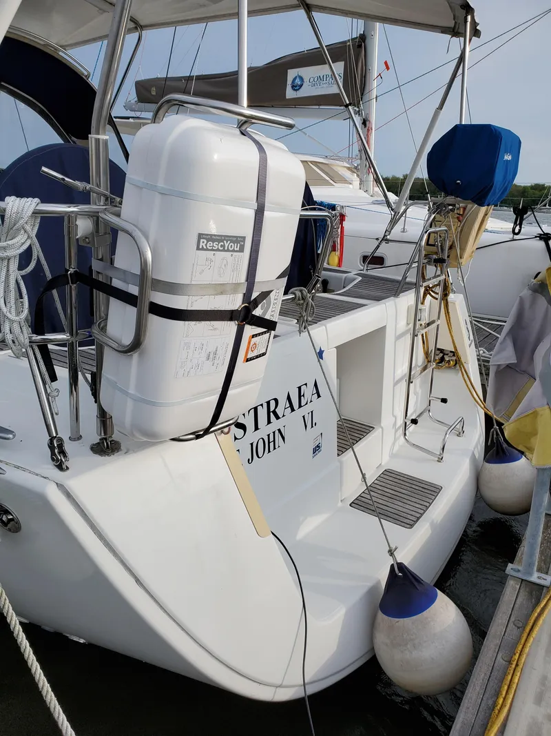 Slide: The Image of 2008 Beneteau 43 sailboat docked, featuring safety equipment and nautical accessories. - 6