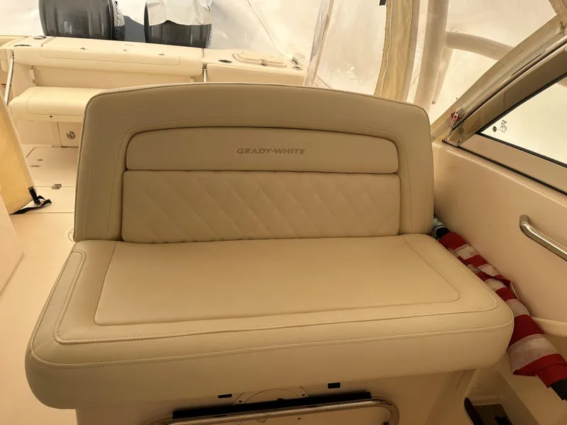 Slide: The Image of 2022 Grady-White Freedom 325 boat interior with beige seating and elegant design. - 5