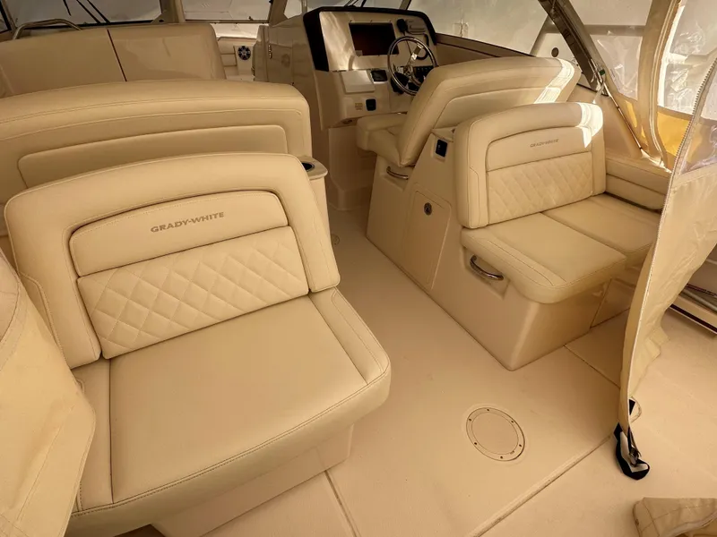Slide: The Image of Luxurious interior of 2022 Grady-White Freedom 325 boat with beige leather seating. - 7