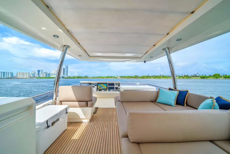 Slide: The Image of Luxurious 2015 Prestige 750 yacht interior with spacious seating and scenic water views. - 25