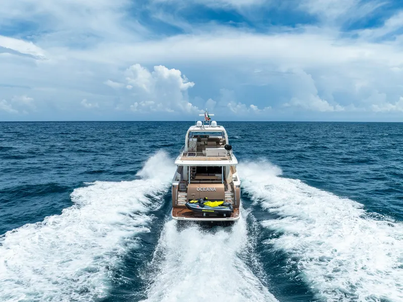 Slide: The Image of Prestige 750 yacht cruising on open sea, 2015 model, under a clear blue sky. - 3