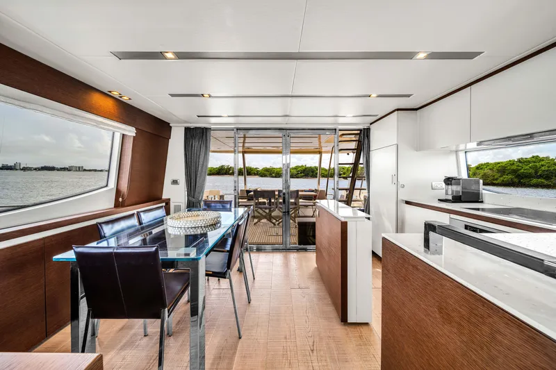 Slide: The Image of Luxurious interior of 2015 Prestige 750 yacht with modern dining area and scenic views. - 39