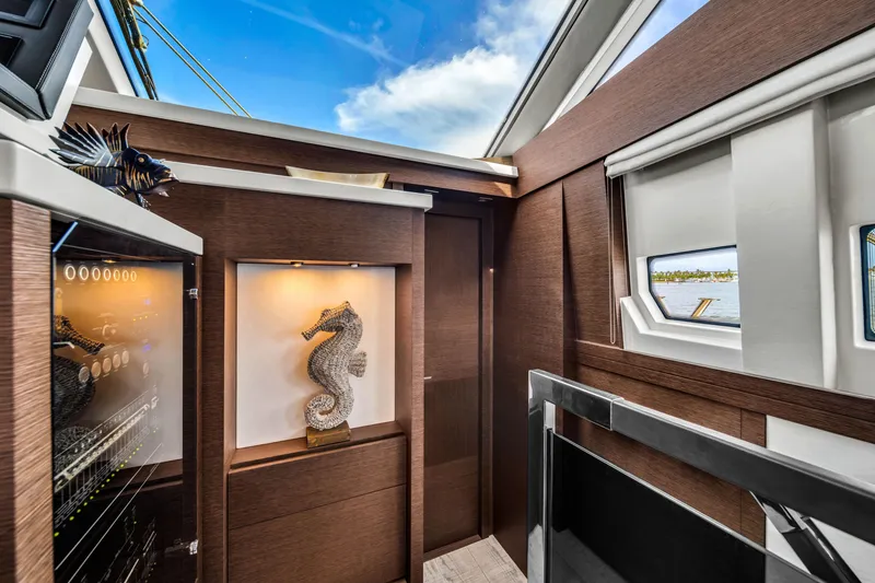 Slide: The Image of Luxurious interior of 2015 Prestige 750 yacht with elegant decor and seahorse sculpture. - 46