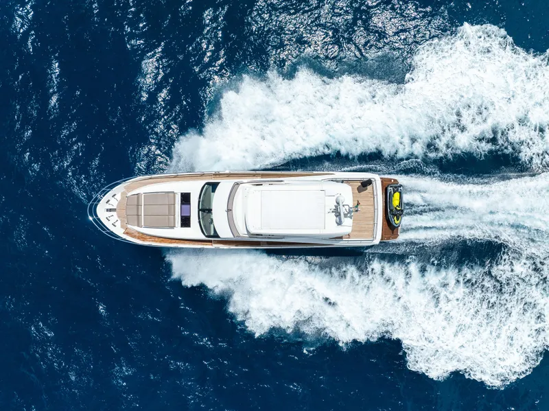 Slide: The Image of Aerial view of 2015 Prestige 750 yacht cruising on open blue sea. - 5