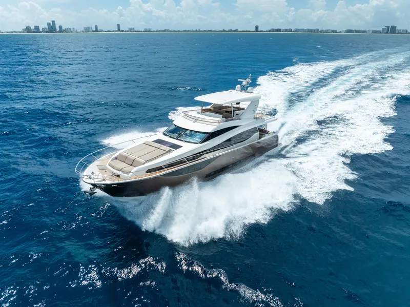 Slide: The Image of Luxury 2015 Prestige 750 yacht cruising on open blue sea. - 6