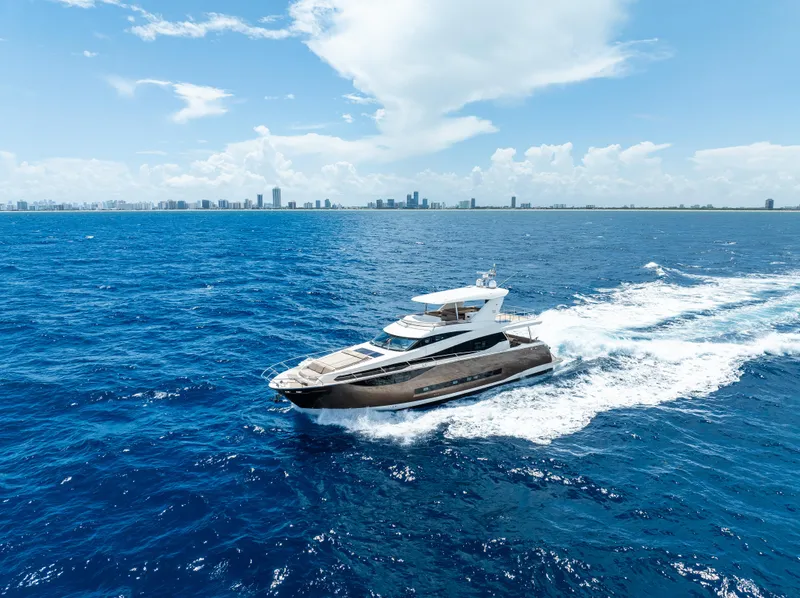 Slide: The Image of Luxury Prestige 750 yacht cruising on open blue sea, 2015 model. - 7
