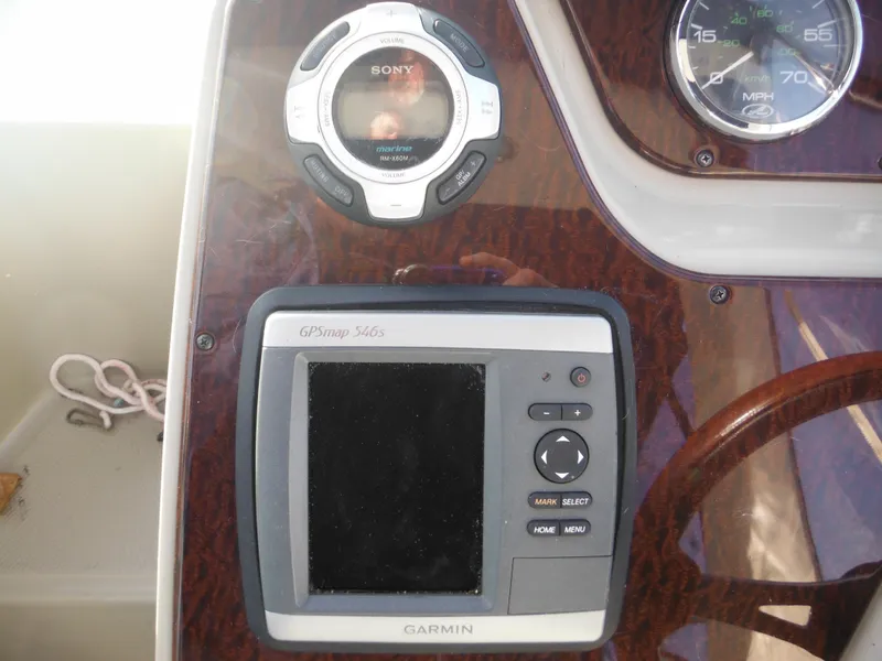 Slide: The Image of Dashboard of 2010 Sea Ray 260 Sundancer with Garmin GPS and Sony audio system. - 15