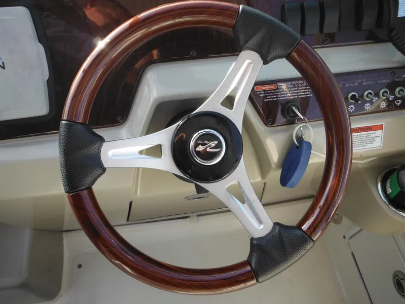 Slide: The Image of Steering wheel of 2010 Sea Ray 260 Sundancer boat with key fob. - 16