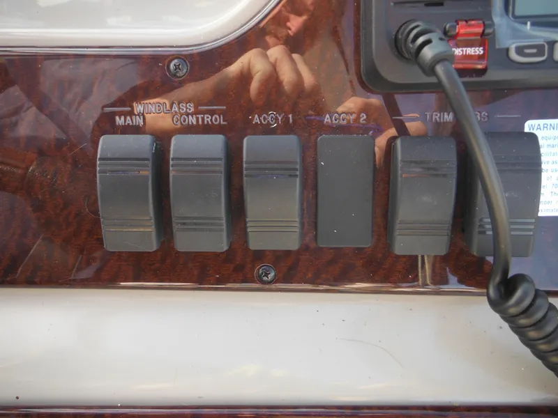 Slide: The Image of Control panel of 2010 Sea Ray 260 Sundancer boat with switches and dials. - 18